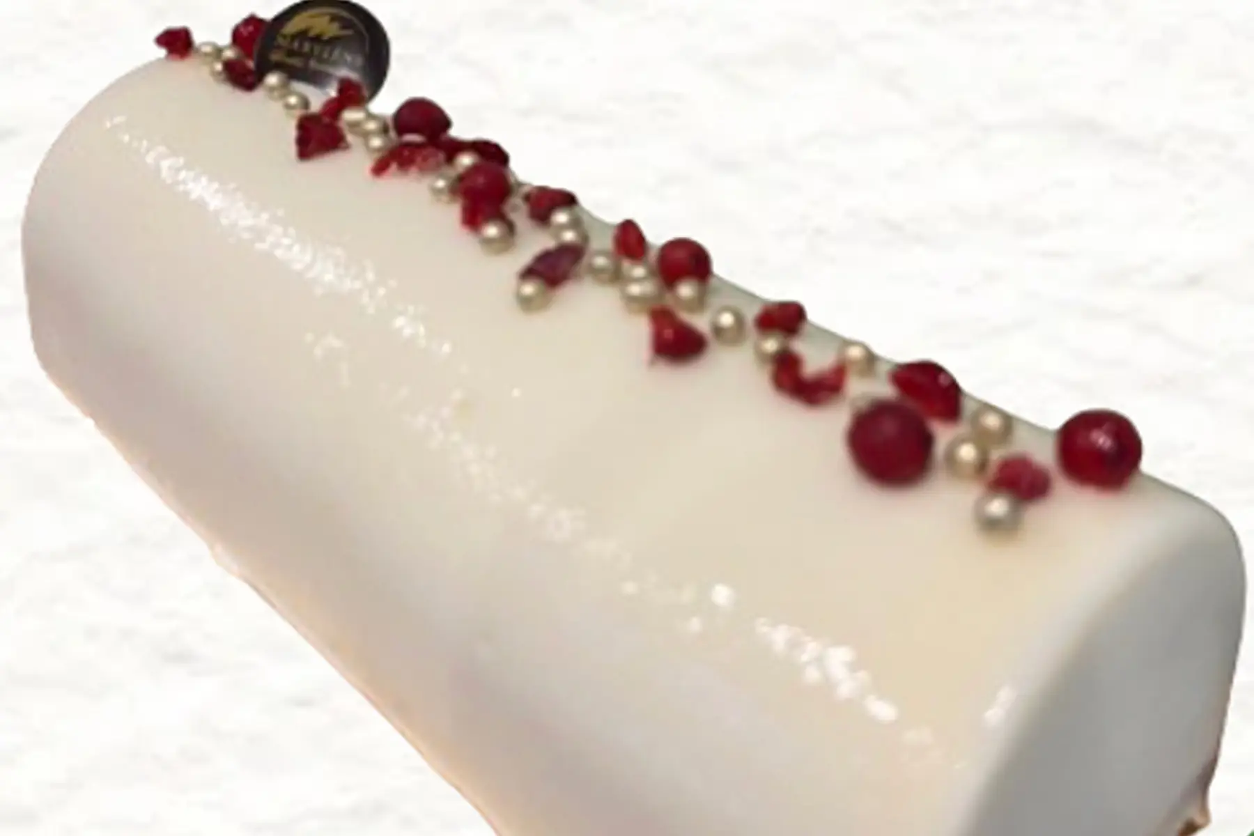 Bûche crème glacée Litchi et sorbet framboise sur biscuit Steusel 4/5 parts